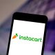 Some Instacart shoppers are claiming that their groceries are being stolen by the company's shoppers during the coronavirus pandemic. In this photo illustration the Instacart logo is seen displayed on a smartphone.