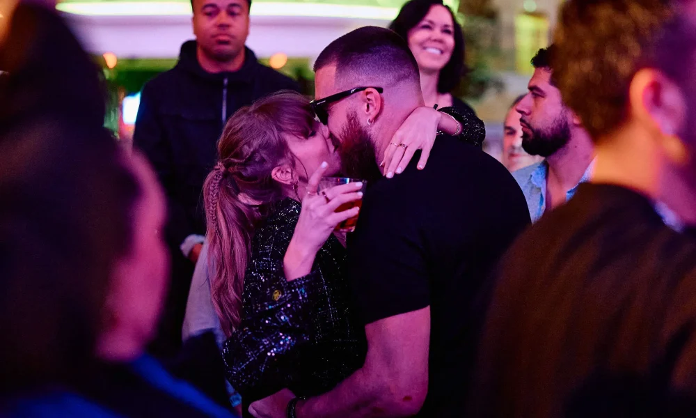 Taylor Swift and Travis Kelce share a kiss at XS Nightclub as Kansas City Chiefs celebrate Super Bowl win