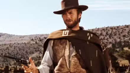 Clint Eastwood aiming his gun in the desert in The Good, the Bad and the Ugly