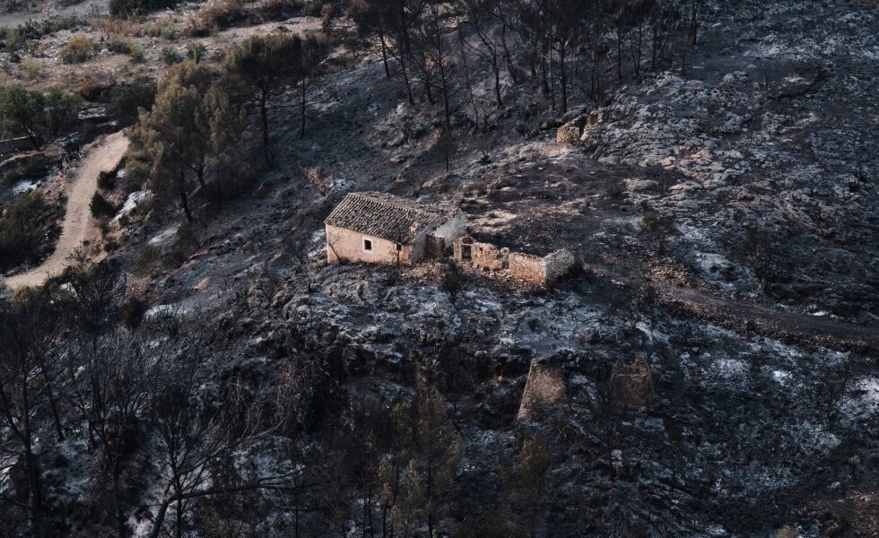 Firefighters and helicopters battle deadly wildfires in Spain