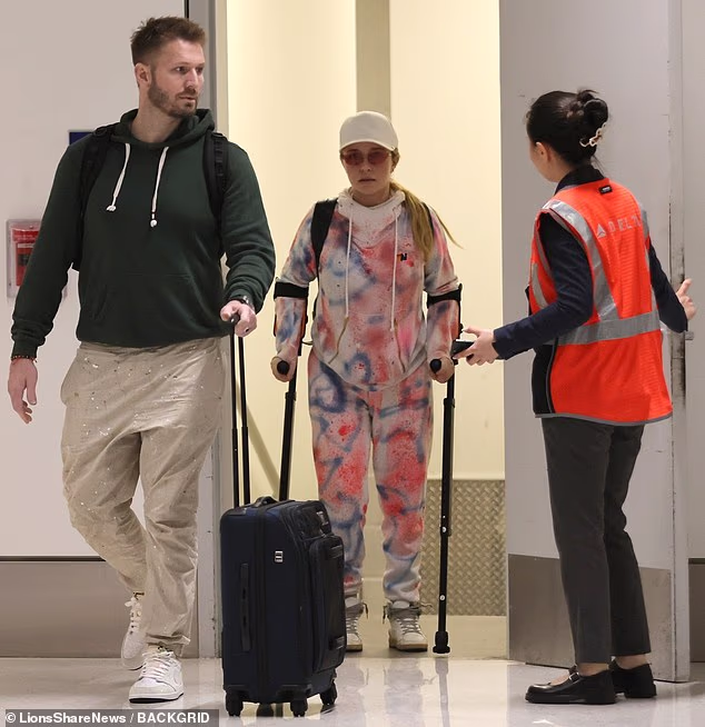 Months before her death at the age of 36, Hayden Panettiere relied on crutches and the assistance of others for help walking as she struggled with a painful back injury - seen hobbling at LAX with ex-boyfriend Brian Hickerson in March