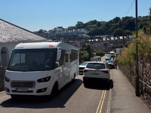 One St Ives resident shared a video of cars parked by 'emmits' on double yellow lines, blocking the narrow and winding road