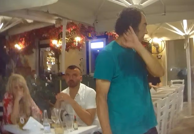 A Daily Mail undercover investigation found British tourists are being routinely fleeced by unscrupulous bars and restaurants in Corfu. At The Corner restaurant the sweaty owner pictured was brusque when neither our reporter nor the waitress could understand the bill