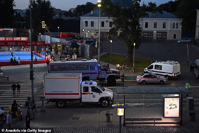Emergency services are pictured at the scene following an explosion at a cafe in Moscow
