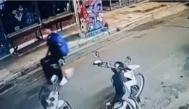 This is the moment an Afghan professional boxer walks through the streets of Athens carrying a suitcase allegedly containing the body of Briton Elisabeth-Jane Ross