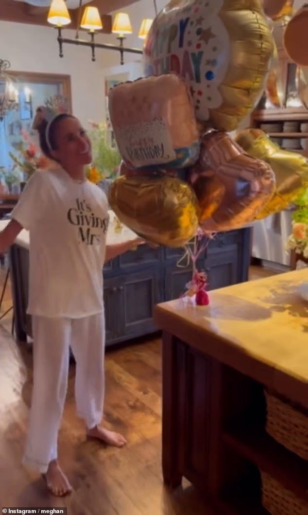 Meghan Markle has posted a new clip of her dancing to a happy birthday song to mark her turning 45 - white wearing a tiara-like headband