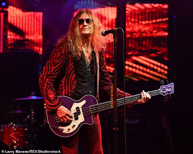 Deep Purple singer-musician Glenn Hughes, 74, said Tuesday he is retiring from touring as he prepares to undergo heart surgery. Pictured 2024 in Fort Lauderdale, Florida