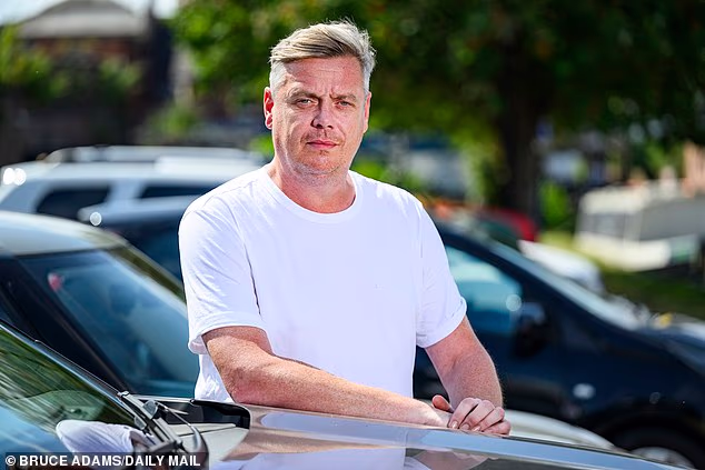 Andrew Lees, 47, who was wrongly accused of driving while disqualified after a clerical error saw someone else's crime added to his driving licence record