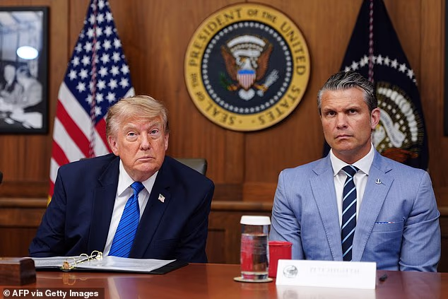 US President Donald Trump and US Secretary of Defense Pete Hegseth listen to questions from the press during a Cabinet meeting at Camp David