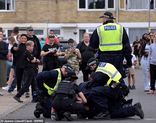 Poilce make arrests in Thetford on the third night of protests over asylum seekers being housed in the area