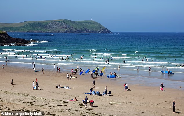 Hundreds of tourists have fallen ill after visiting UK beaches, new figures have revealed, including Polzeath Beach in Cornwall (pictured)