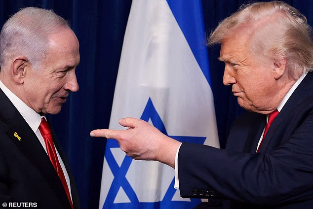 US  President Donald Trump points his finger towards Israeli Prime Minister Benjamin Netanyahu during a press conference in December of 2025