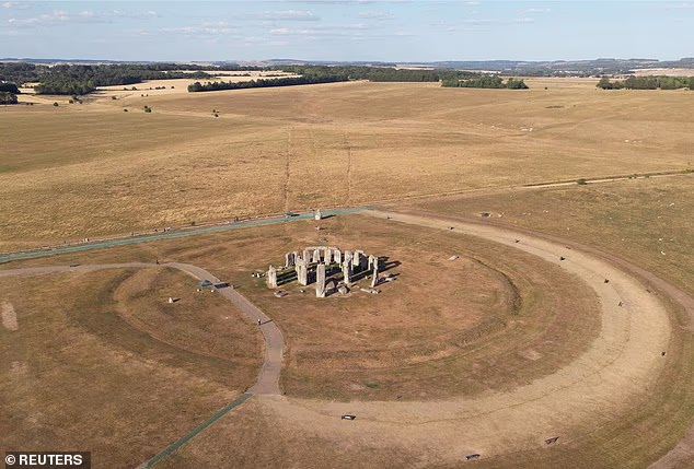 A drone view shows parched grassland around Stonehenge in Wiltshire on July 31