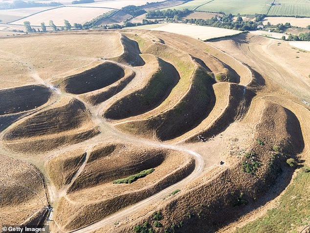 An aerial view of the dried out ground of Maiden Castle Iron Age hillfort, Dorchester