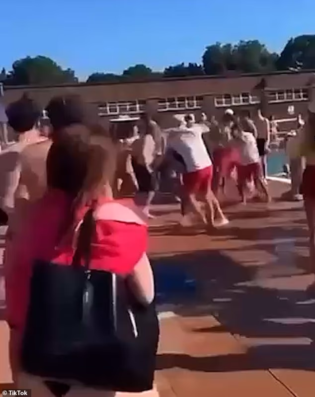 Video footage shared with the Daily Mail shows a huge poolside brawl over the May Bank Holiday weekend at Parliament Hill Fields Lido in north London