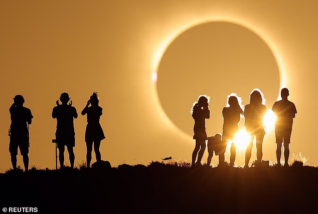 Solar eclipse in pictures: Stunning snaps show the moment the moon covered the face of the sun