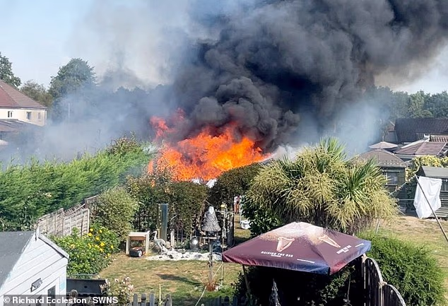 A fire has ripped through a residential area in Tamworth on Thursday morning, with one woman taken to hospital for burns