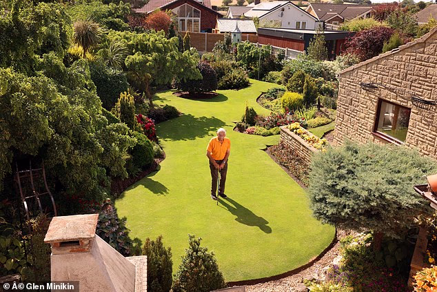 Stuart Grindle from Tickhill, Doncaster who has a competition winning garden that he is managing to keep luscious green in the heatwave