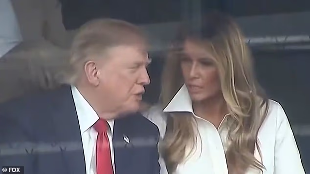 Viral videos caught First Lady Melania Trump and President Donald Trump engaged in an 'intense' conversation at the Freedom 250 Grand Prix in DC on Sunday, as close aide Natalie Harp lurked just behind them