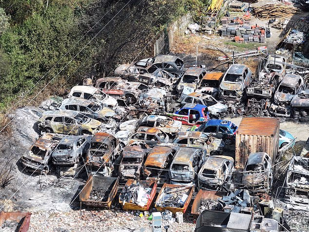 The aftermath shows the burnt out shells of cars