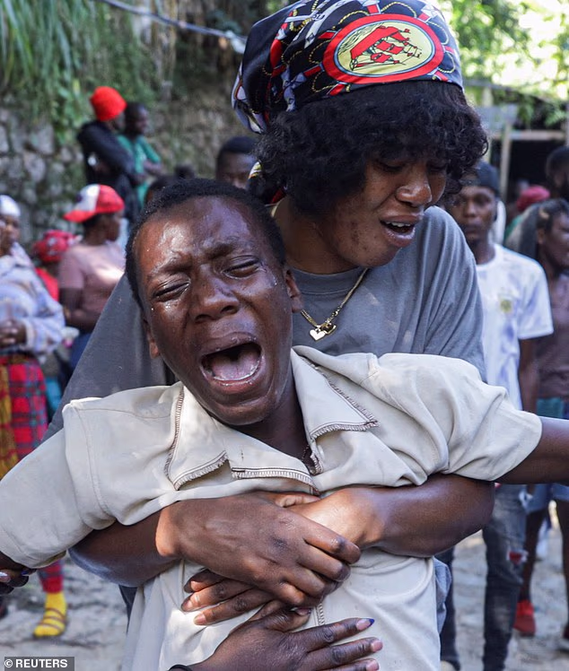 A massacre inside a church has left at least 40 people dead after a 'night of terror' saw gang members attack displaced people huddling inside the religious building