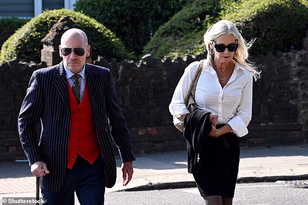Darren Lee Scotchbrook arrives at court with his wife who has a condition which limits how long they have sex