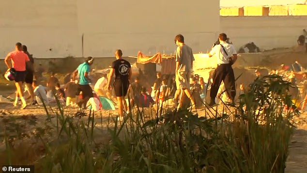 Thousands of residents on Ceuta stormed a makeshift migrant camp and set it on fire
