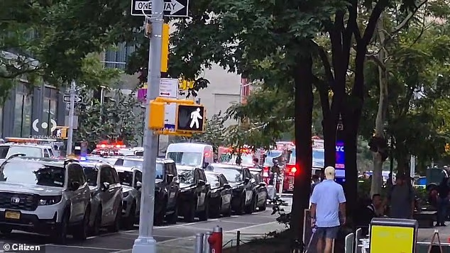 A man has been rushed to the hospital after he set himself on fire inside the lobby of a downtown Manhattan office building