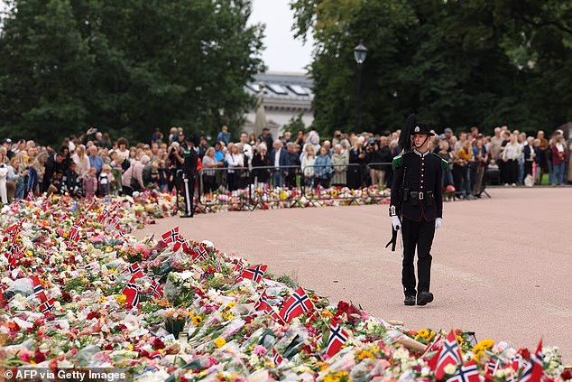 Thousands of mourning Norwegians laid hordes of flowers outside the royal palace in Oslo as they bid farewell to Europe's oldest monarch