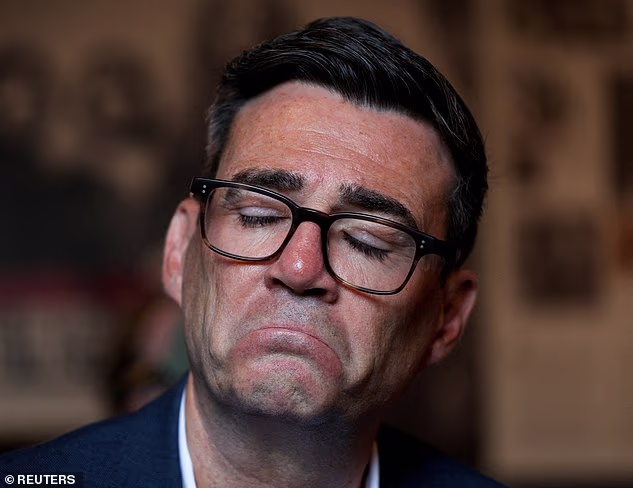 Prime Minister Andy Burnham reacts as he meets with the youth during a visit to Northern Ireland