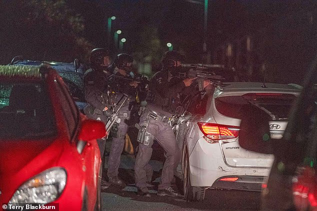 Armed police raided two homes in Grangetown, near Middlesbrough, in the early hours of today following a week of violence