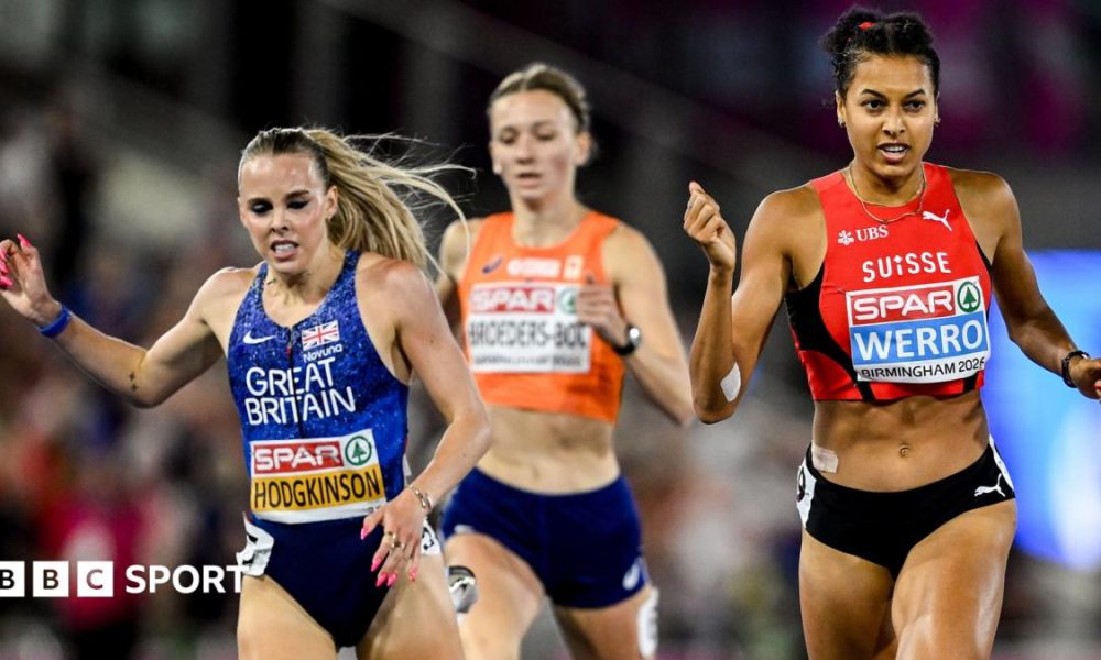 Keely Hodgkinson in a crown with her coaches in the background