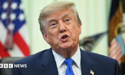 A close up shot of President Donald Trump speaking at the Oval Office.