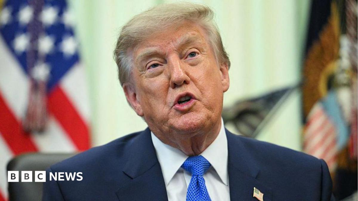 A close up shot of President Donald Trump speaking at the Oval Office.