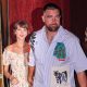 Taylor Swift and Travis Kelce were seen walking out of a restaurant on their wedding weekend in New York City. She is wearing a floral dress and he is seen in a short-sleeved button-down shirt and pants.
