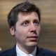OpenAI chief Sam Altman answering questions in a hallway during a trip to Washington DC.