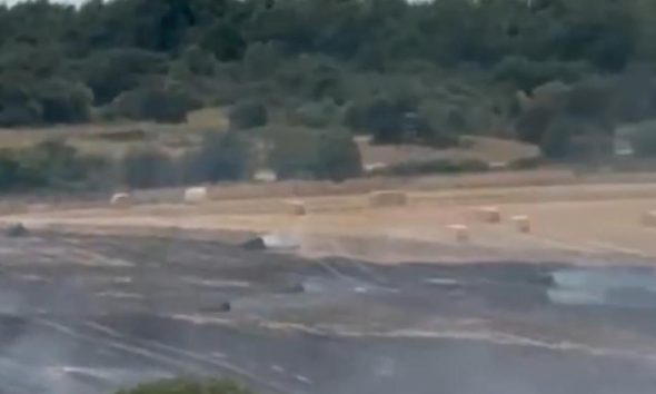 Fire crews tackle major field fire in farm in Craghead
