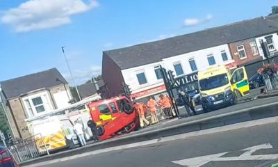 Car on roof after crash at Blackburn Road junction