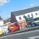 Car on roof after crash at Blackburn Road junction