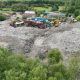 Four men arrested after alleged waste dumping at Wigan site