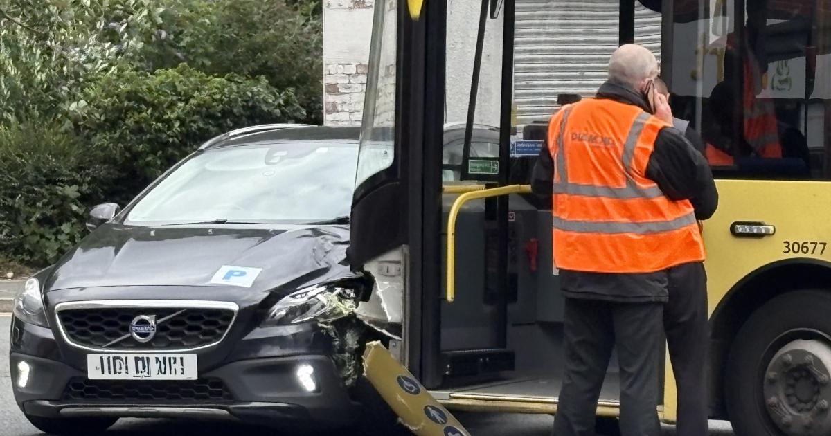 Bolton town centre traffic delayed after car and bus crash