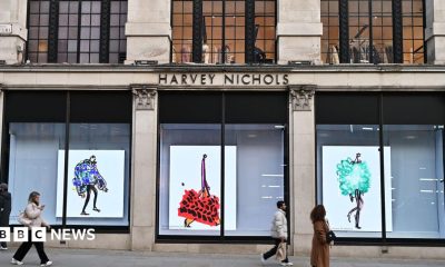 People walking past a luxury department store in Knightsbidge, London