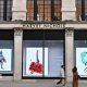 People walking past a luxury department store in Knightsbidge, London