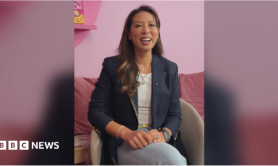 The co-founder of Little Moons, Vivien Wong smiles. She wears a blue blazer and jeans and has long, straight brown hair.