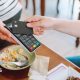 A person pays with a credit card in a restaurant