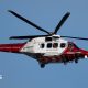 A coastguard helicopter in red and white livery
