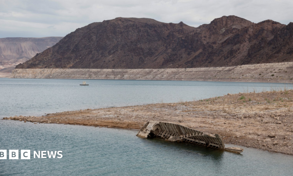 A World War II-era Higgins landing craft rests on the exposed shoreline at Lake Mead National Recreation Area