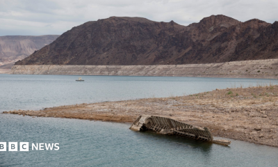 A World War II-era Higgins landing craft rests on the exposed shoreline at Lake Mead National Recreation Area