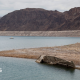 A World War II-era Higgins landing craft rests on the exposed shoreline at Lake Mead National Recreation Area