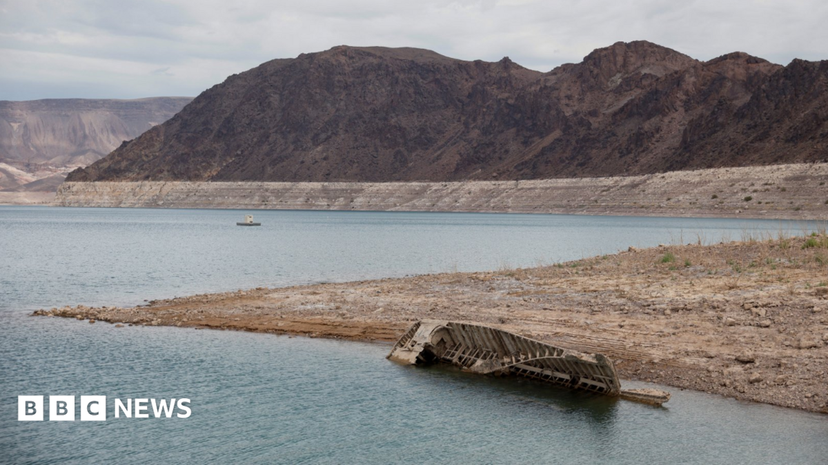 A World War II-era Higgins landing craft rests on the exposed shoreline at Lake Mead National Recreation Area